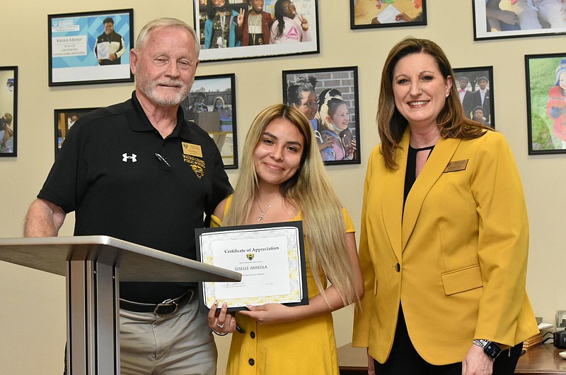 Watson Chapel High School valedictorian Giselle Arreola, center, was named co-Wildcat Warrior for May. She is pictured with Superintendent Tom Wilson and assistant principal LaDonna Spain. (Pine Bluff Commercial/I.C. Murrell)