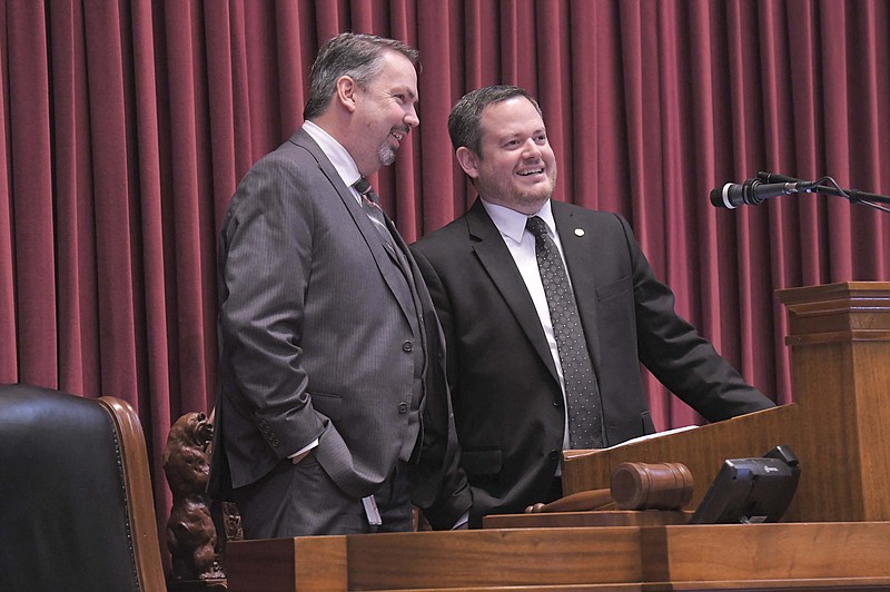 State Rep. Jamie Gragg, R-Ozark, talks with Rep. Brad Hudson, R-Cape Fair, as he presides as Missouri House Speaker. While legislators often argue, they also experience lighter moments as they work closely over the course of several months. (Submitted photo courtesy of Tim Bommel, House Communications)