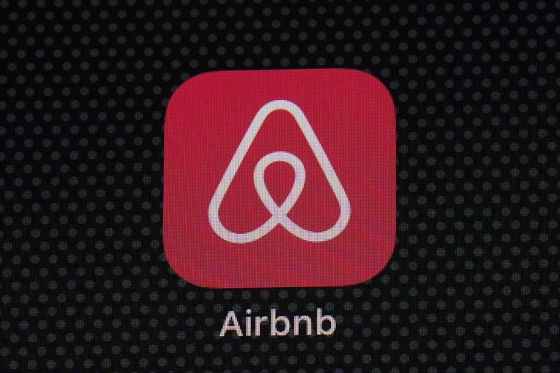 FILE - The Airbnb app icon is displayed on an iPad screen in Washington, D.C., on May 8, 2021. Airbnb Inc. reports quarterly financial results on Tuesday, May 9, 2023.   (AP Photo/Patrick Semansky, File)