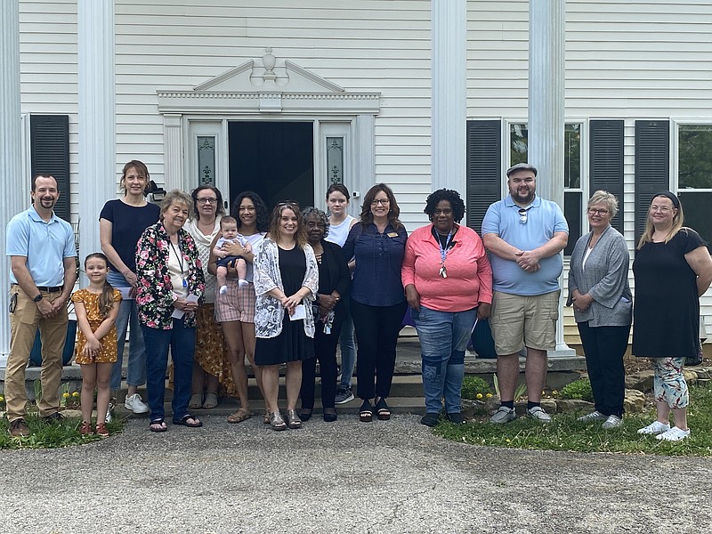 Anakin Bush/Fulton Sun
Community members, mothers and Faith Maternity Care members stand in front of the FMC house at Saturday's Baby Bottle Drive Fundraiser kick-off event. This is the second year FMC has offered this fundraising event.