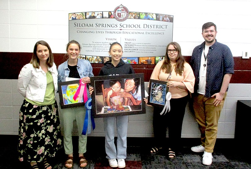 Marc Hayot/Herald-Leader

Art Teacher Angie Howie (left) poses with Caroline Dewey, Denise Lor, MacKenzie Turner and Tyler Voss at the school board meeting on Thursday, May 11. Dewey and Lor were the fourth and first place winners in the 2023 Third Congressional Art Competition.