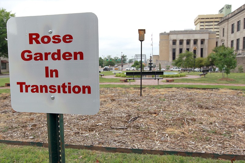 County workers removed all the hybrid tea roses at the Pulaski County Courthouse early in 2010, and signs saying "Rose Garden in Transition" marked the area for several months until more climate-appropriate rose varieties and other flowering perennials filled the two semicircular gardens. (Democrat-Gazette file photo)