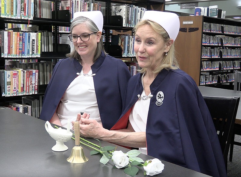 Margo Bushmiaer, right, and Lisa Tinney discuss the Hot Springs chapter of the Arkansas Nurses Honor Guard, which provides appreciation services for late nurses. – Photo by Courtney Edwards of The Sentinel-Record
