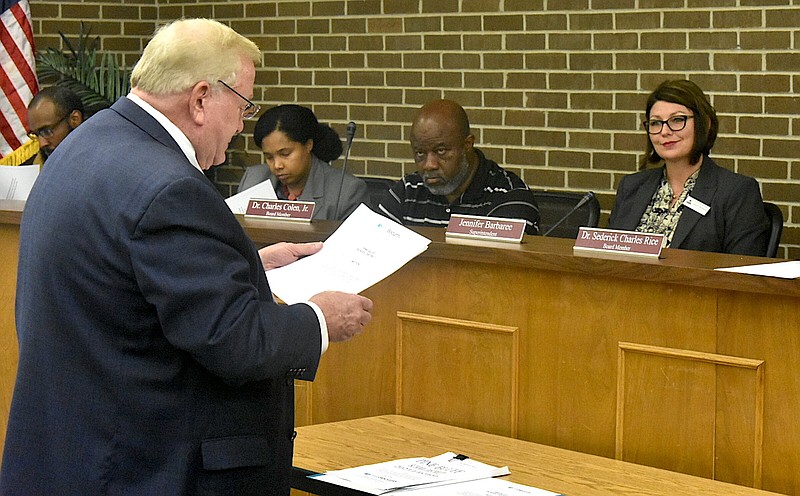 Ray Beardsley, a financial advisor with First Security Beardsley, informs Pine Bluff School District board members Ricky Whitmore Jr. (left), Lori Walker Guelache and Charles Colen and Superintendent Jennifer Barbaree about the resolutions needed to request a special election for a millage increase during a special meeting Wednesday. (Pine Bluff Commercial/I.C. Murrell)