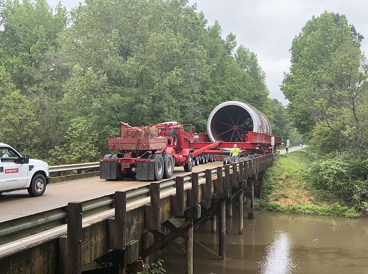 A 300-ton furnace kiln is making its way through south Arkansas to Gum Springs, traveling through Union County May 10-12. On Wednesday, there was a tight squeeze as the kiln and its multi-vehicle convoy traversed an old bridge on Highway 275, north of Strong. The kiln will complete its journey through Union County today as it passes into Ouachita County. (Courtesy of the Arkansas Department of Transportation/Special to the News-Times)