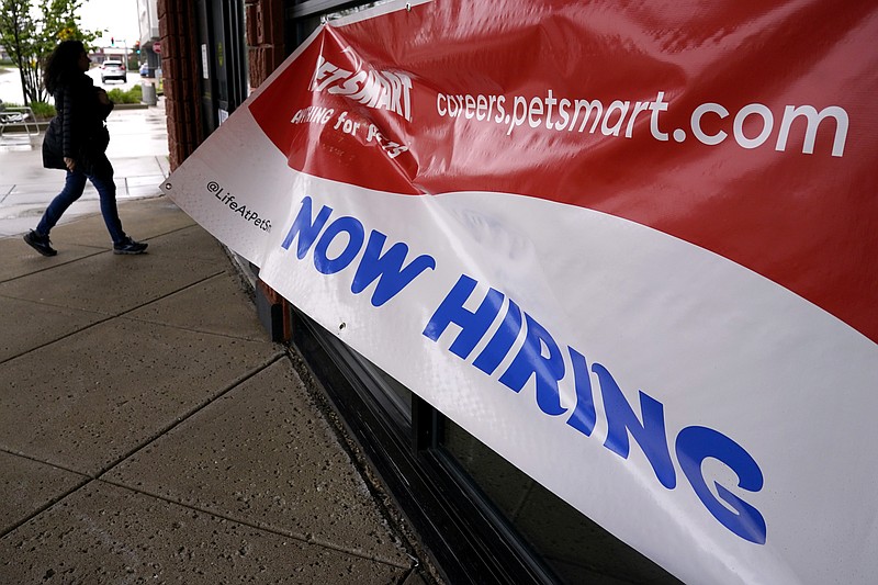 A hiring sign is displayed at a retail store in Downers Grove, Ill., Monday, May 1, 2023. On Thursday, the Labor Department reports on the number of people who applied for unemployment benefits last week. (AP Photo/Nam Y. Huh)