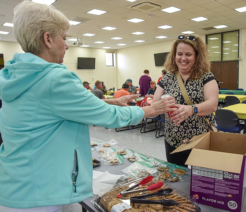 Julie Smith/News Tribune
Angie Toebben of Parks and Rec picks up lunch for co-workers at The Linc Friday. The city hosted an appreciation lunch and while many attended in person, some stayed in the office to continue their work. The picnic was originally intended to be at Riverside Park but the threat of rain pushed the event to the Jefferson City Police Department's classroom at city hall.