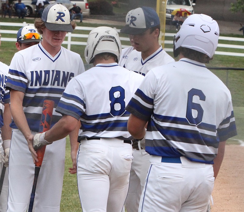 Russellville pitcher/center fielder (#8) is congratulated by his teammates after hitting a two-run home run in the second inning against California. (Democrat photo/Evan Holmes)