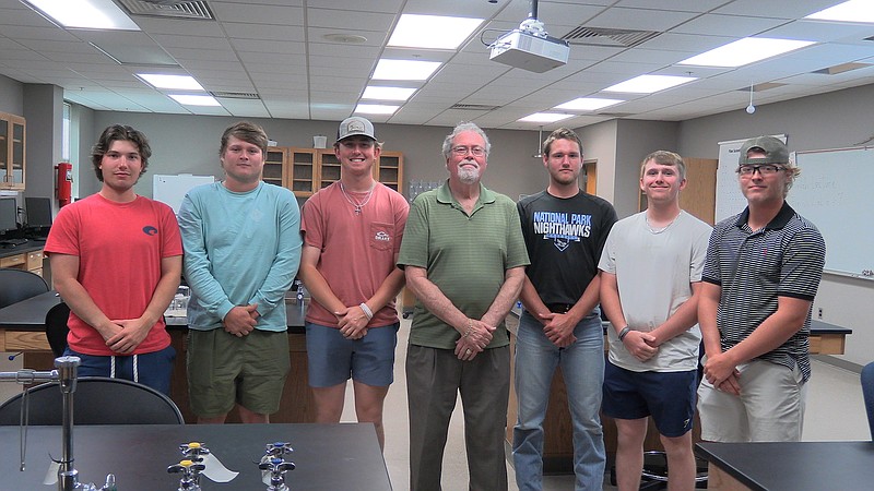 Students who participated in the geology study, from left, John Satterfield, Luke Hindman, Eli Hutcherson, George Maxey, Landon Williams, Isaac House and Ty Thomerson, are shown in Maxeys lab at National Park College. – Photo by Courtney Edwards of The Sentinel-Record