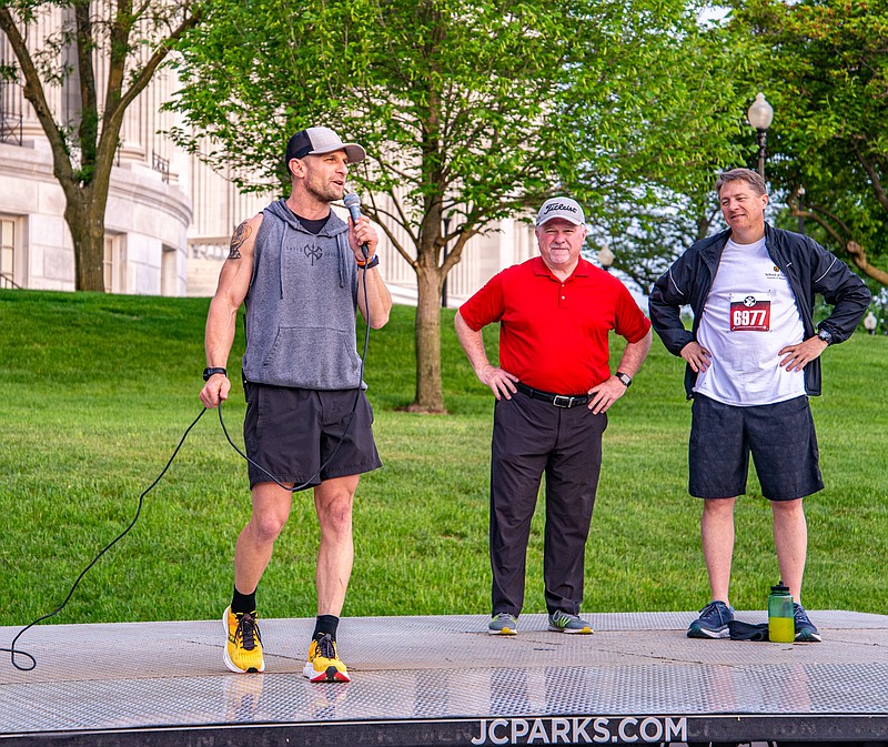 Matt Chinn, organizer of the Capital City Race, welcomes runners and supporters to the inaugural event to raise awareness for mental health in the memory of his friend Jared Palmer Saturday morning at the Capitol.  (Ken Barnes/News Tribune)