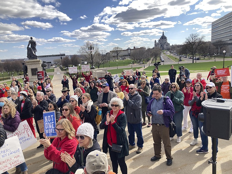 Gun safety advocates rally on the steps of the Minnesota State Capitol on Tuesday, April 25, 2023, in support of gun safety legislation that was scheduled for debate in the Minnesota House in Saint Paul, Mich. (AP Photo/Steve Karnowski)