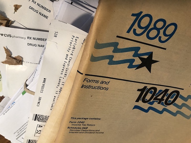 It's a safe bet that you won't need your 1989 tax booklet in your new, smaller abode. (Arkansas Democrat-Gazette/Celia Storey)