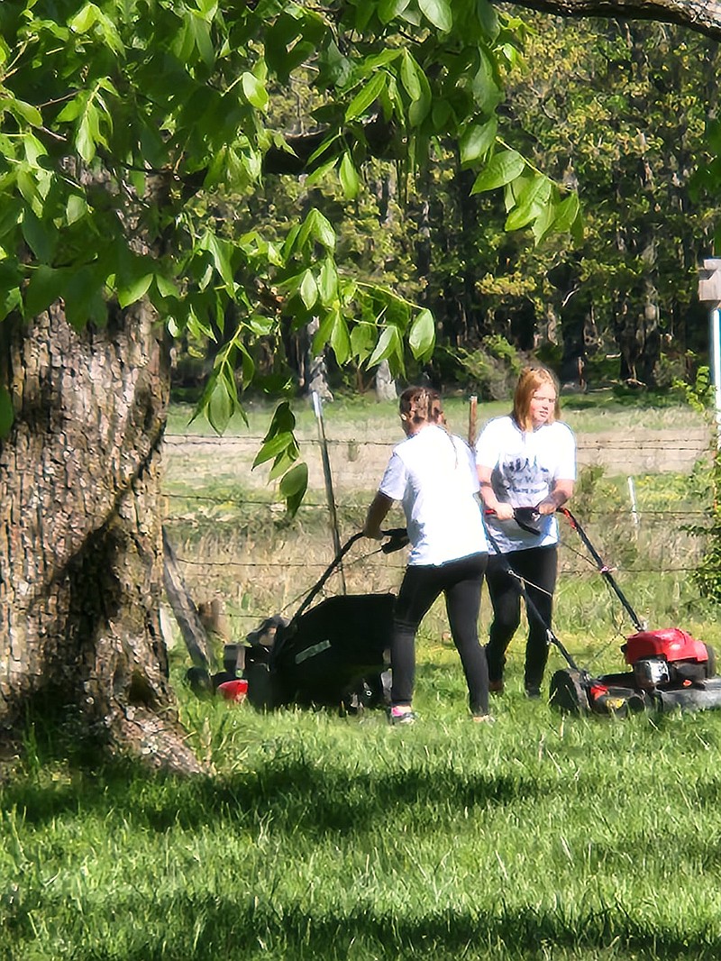 Photo submitted/Special to the McDonald County Press
The Alger sisters are volunteering their time this summer to help people with lawnmowing.