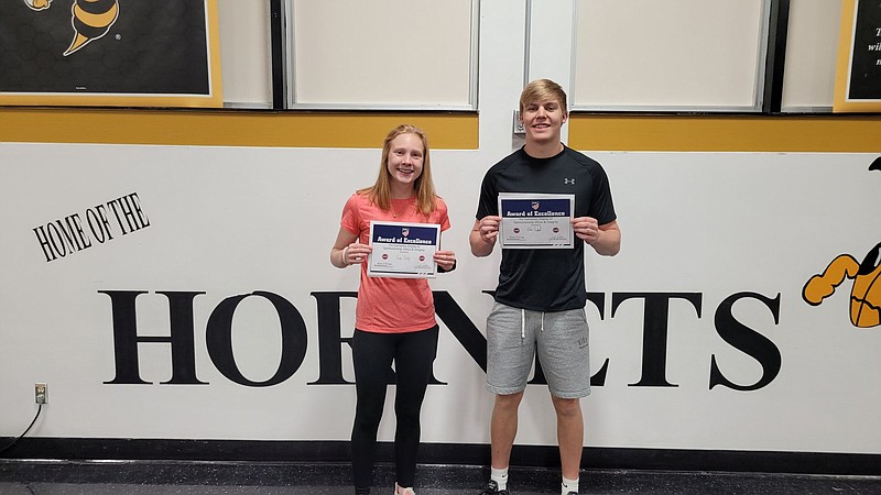 Fulton's Grace Ousley (left) and Aidan Haglund (right) pose with their MSHSAA sportsmanship awards Monday at Fulton High School in Fulton. (Courtesy/Fulton Acitivites)