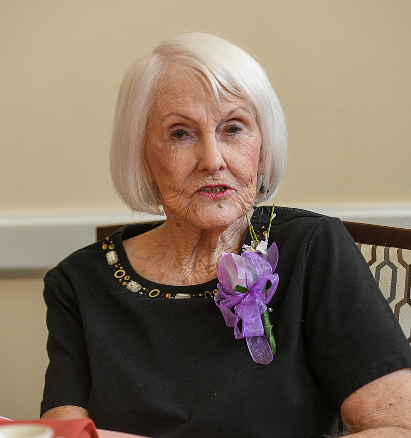 Julie Smith/News Tribune photo: 
Jenella Frissell visits with a tablemate Monday, May 15, 2023, as she waits to be served lunch at Heisinger Bluffs. Frissell sported a corsage that was made by a staffer for each of the moms who attended the Mother's Day Brunch at Heisinger Bluffs.