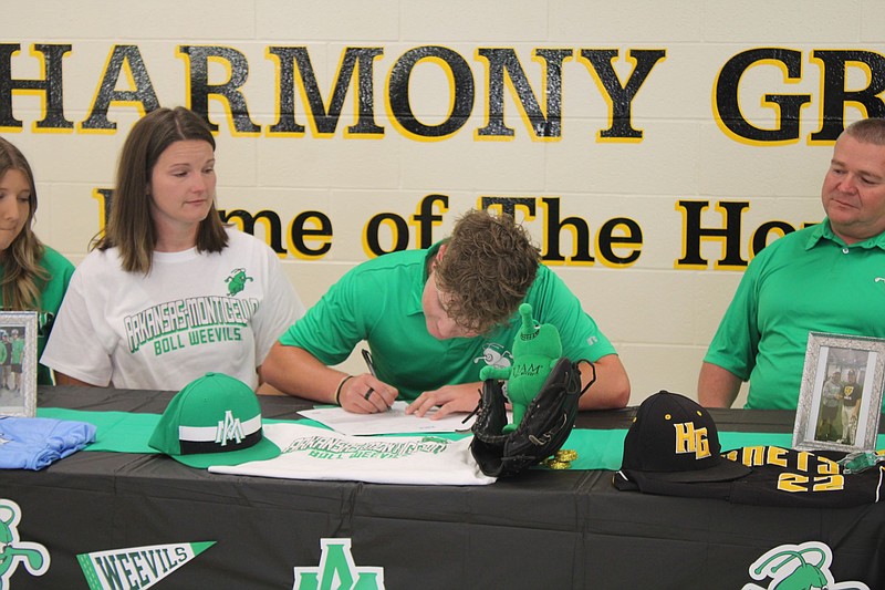 Photo By: Michael Hanich
Harmony Grove's Braden Brown signing his letter of intent with UAM during his signing day.