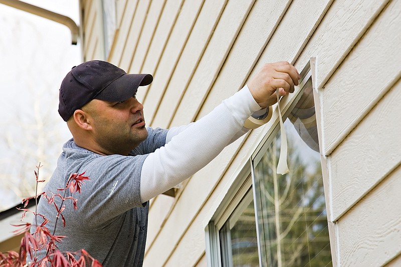 Protecting edges and working around windows and doors are important parts of home painting. (Dreamstime/TNS)