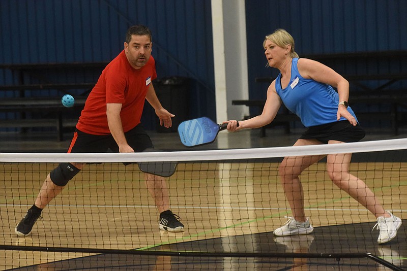 TEAM WORK FOR CHILD SAFETY
Kenny McCollum and Deanna Franzke compete on Saturday April 16 2022 during a round-robin pickleball tournament at the Springdale Recreation Center. The tournament was a benefit for the Children's Safety Center of Springdale, organizers said. Fifty pickleball players signed up for the tournament and each competed in several games, said Kerri Mason, an event volunteer. Go to nwaonline.com/220417Daily/ to see more photos. 
(NWA Democrat-Gazette/Flip Putthoff)