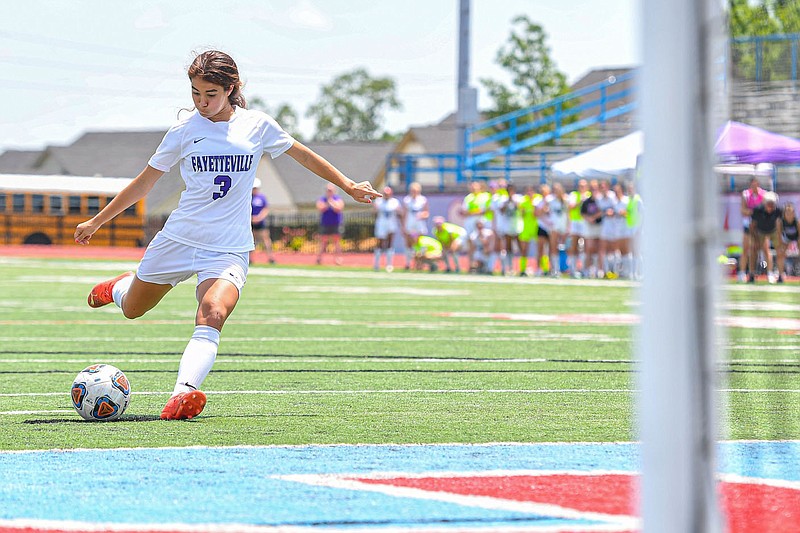 Fayetteville's Eleanor Lock shoots and scores the game-winning penalty kick goal, Saturday, May 13, 2023, during a sudden-death shootout in the Lady Bulldogs' 4-3 win against the Mount St. Mary Belles in the semifinal round of the Class 6A girls soccer state tournament at Jim Rowland Stadium in Fort Smith. The Lady Bulldogs will take on Bentonville, a 3-0 winner against Rogers in the other semifinal, in the state championship at 6 p.m. Saturday in Conway.
(River Valley Democrat-Gazette/Hank Layton)