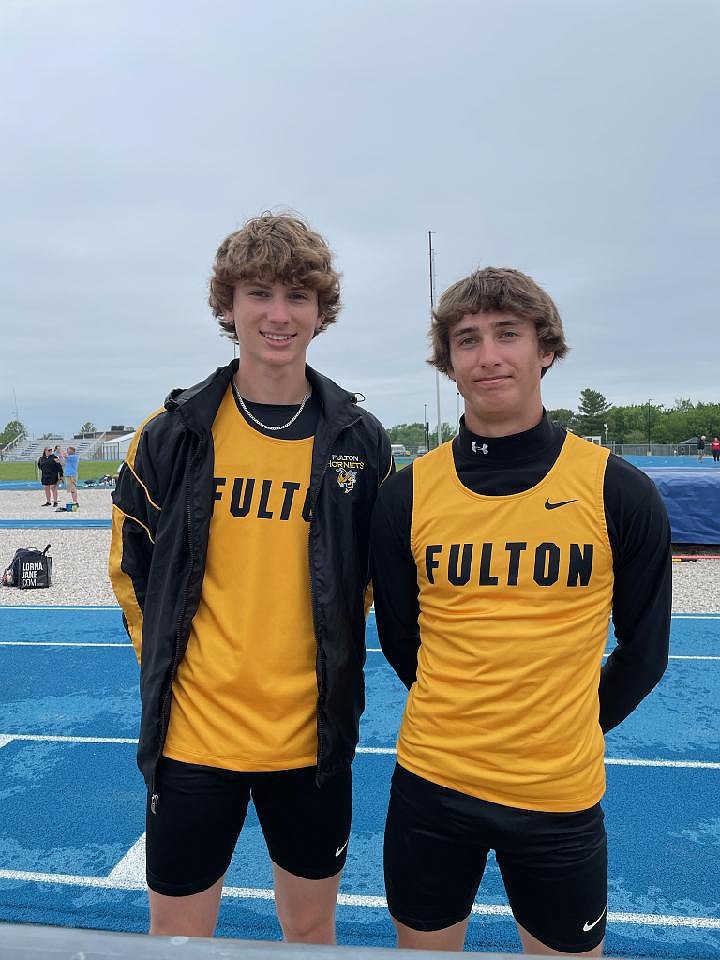 Fulton's Ethan Milius and Gabe DeFily pose for a photo after competing in the triple jump in the Class 4 District 4 meet Monday at Montgomery County High School in Montgomery City. Milius won the event, while DeFily took third; both started in Fulton baseball's upset against Southern Boone, combining for three hits. (Courtesy/FHS Hornet Track & Field)