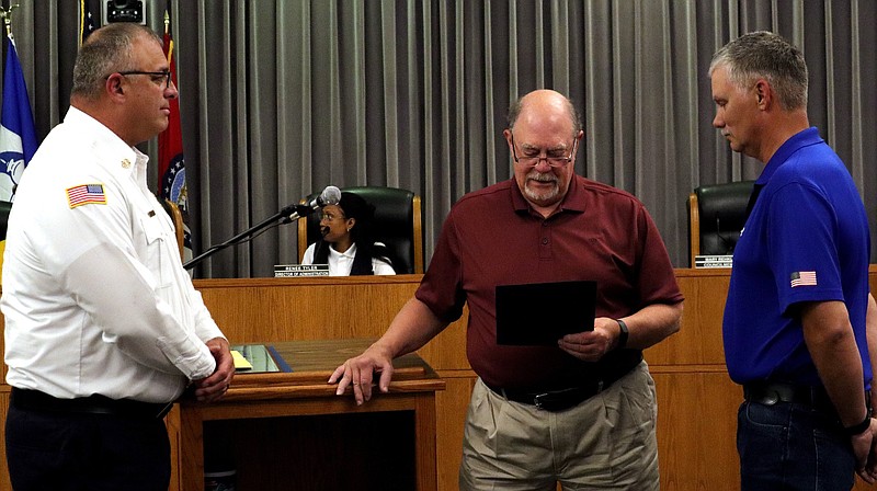 Photo courtesy of the City of Fulton: 
Fulton Mayor Steve Myers (middle) reads a proclamation of recognition and appreciation to retiring fire captain Steven Sessler (right). Fire chief Kevin Coffelt (left) also presented Sessler with a plaque and a certificate from Tim Bean, Missouri State fire marshal.
