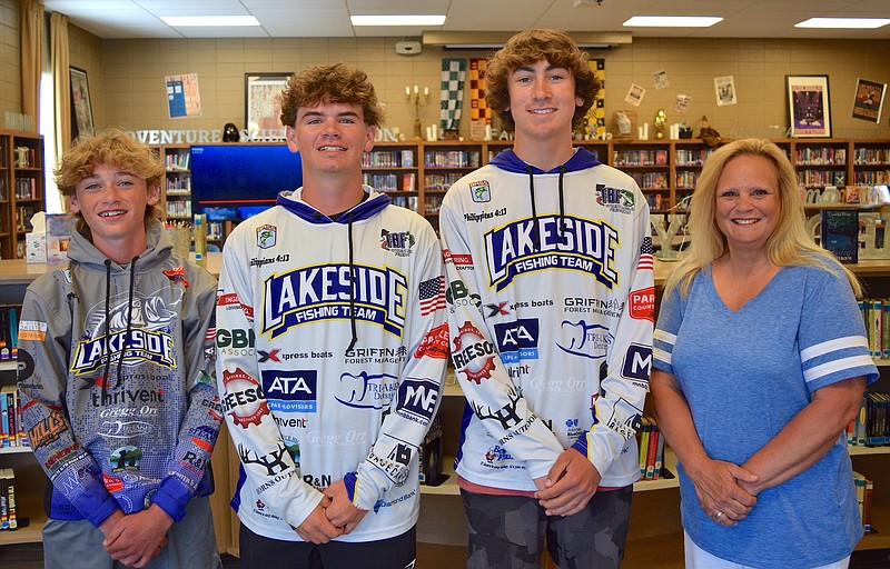 From left, Lakeside Anglers Cash Hurst, a freshman, Kaleb Snow, a junior, and Griffin Ralph, a sophomore, are shown with head fishing coach Christy Culbreath Tuesday in the Lakeside High School Library. - Photo by Donald Cross of The Sentinel-Record