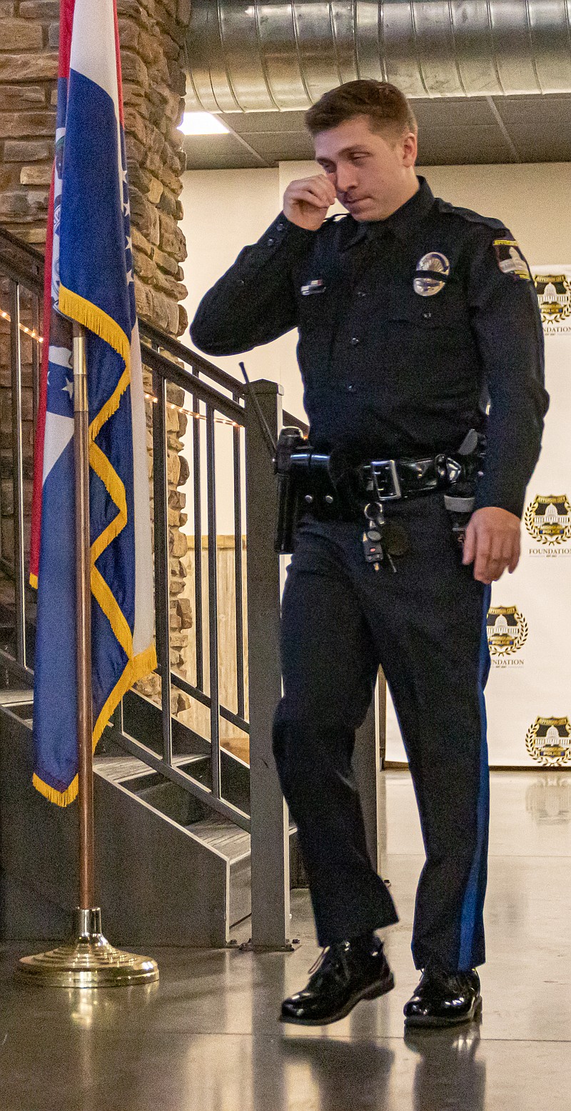 Josh Cobb/News Tribune photo: Officer Dawson Payne couldn't hold his tears back as he stepped up to the stage to receive a service award during the second annual Police Ball held at the Capital Bluffs Event Center. The event was held to celebrate the Jefferson City Police Department and the officers, 911 operators and civilians who have gone above and beyond the call of duty to perform their job.