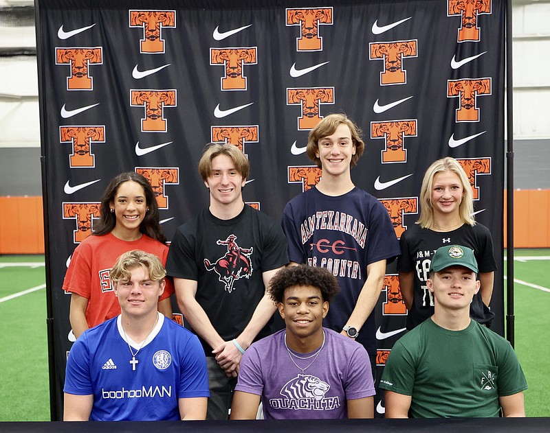 Picture, front row, from left, are Matthew Delk, Daniel Lee and Seth Trusty and, back row, Ally Moore, Austin Judkins, Chapman White and Lakyn Austin. The seven Texas High athletes signed their national letter of intents on Wednesday, May 17, 2023, at Texas High School in Texarkana, Texas. (Photo by JD for the Texarkana Gazette)