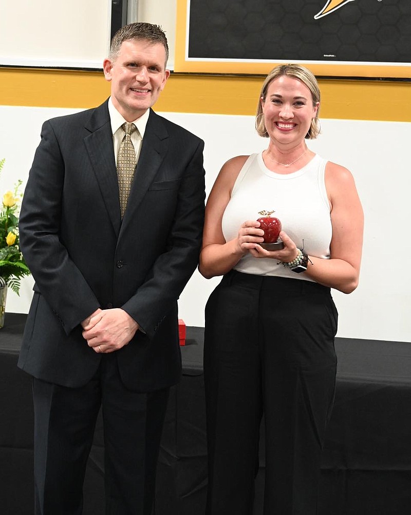 Photo courtesy Fulton Public Schools
Chris Hubbuch, assistant superintendent of Fulton Public Schools, presents Melissa Speer with the 2023 Teacher of the Year award. Speer is a third grade teacher at McIntire Elementary.