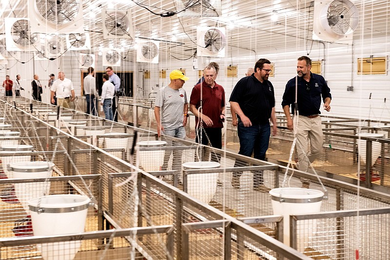 Industry partners walk through the Poultry Science Smart Farming Research Facility at the Milo J. Shult Agricultural Research and Extension Center at Fayetteville. (Special to The Commercial/Fred Miller/University of Arkansas System Division of Agriculture)