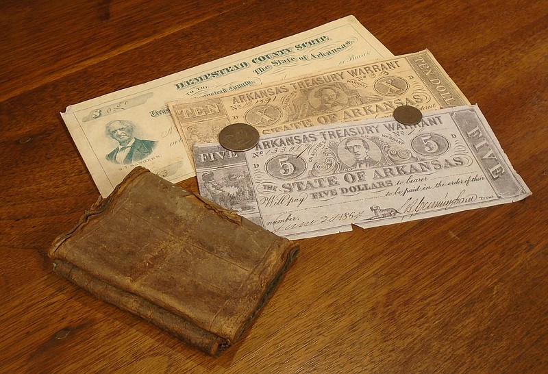 Historic Arkansas currency is seen in this undated photo, including a monetary note specific to Hempstead County. The "In Their Wallet" exhibit will tell the story of how The Natural State built its economy. A presentation on the exhibit is scheduled for 1:30 p.m. Saturday, May 20, 2023, at Historic Washington State Park in Washington, Ark. (Photo courtesy of Historic Washington State Park)