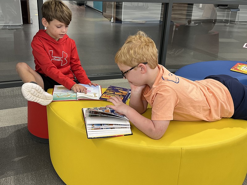 First-graders Zach Cawthon, left, and Lane Wisdom read together in the library at Margaret Davis Fischer Elementary in Texarkana, Texas. For 2021-22, Pleasant Grove ISD placed above the state average in reading. (Photo courtesy Haley Turner)