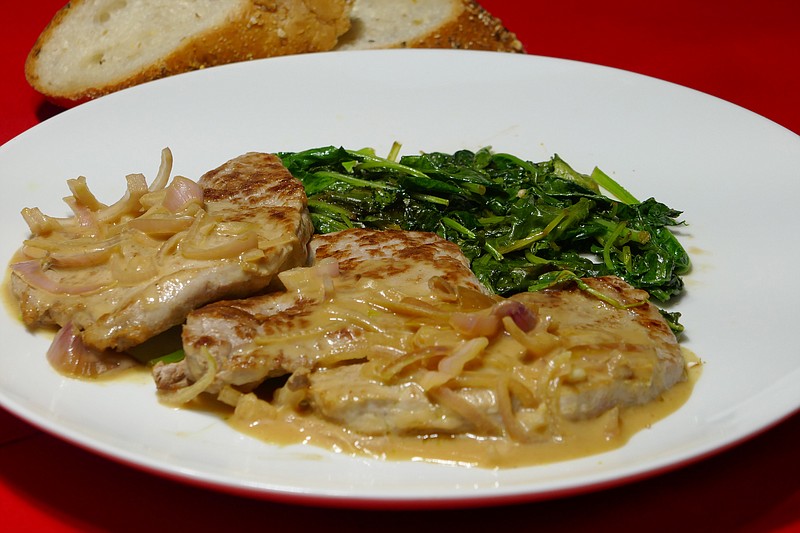 Pork Scallopini with Mustard Sauce and Sauteed Kale. (Linda Gassenheimer/TNS)
