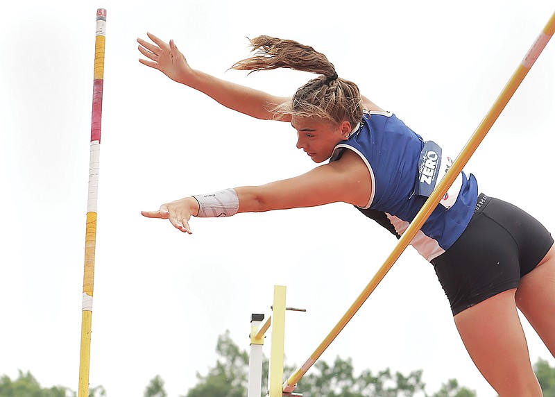 South Callaway senior Lacey Mathews throws her pole after clearing the bar in the girls pole vault Friday during the Class 2 state track and field championships at Adkins Stadium in Jefferson City. (News Tribune/Kate Cassady)