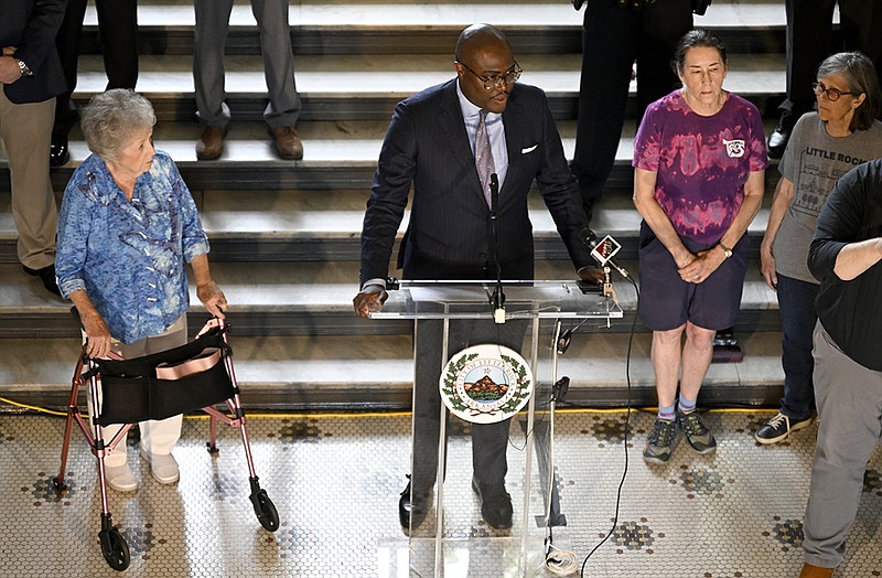 City Directors (from left) Joan Adcock, Capi Peck, and Kathy Webb stand to the side as Mayor Frank Scott, Jr., center, gives an update on tornado recovery during a press conference in the City Hall rotunda on Friday, May 19, 2023. The Mayor announced the distribution plan for nearly $510,000 raised through Little Rock Cares to support Little Rock residents impacted by the March 31 tornado on Friday, May 19, 2023.

(Arkansas Democrat-Gazette/Stephen Swofford)