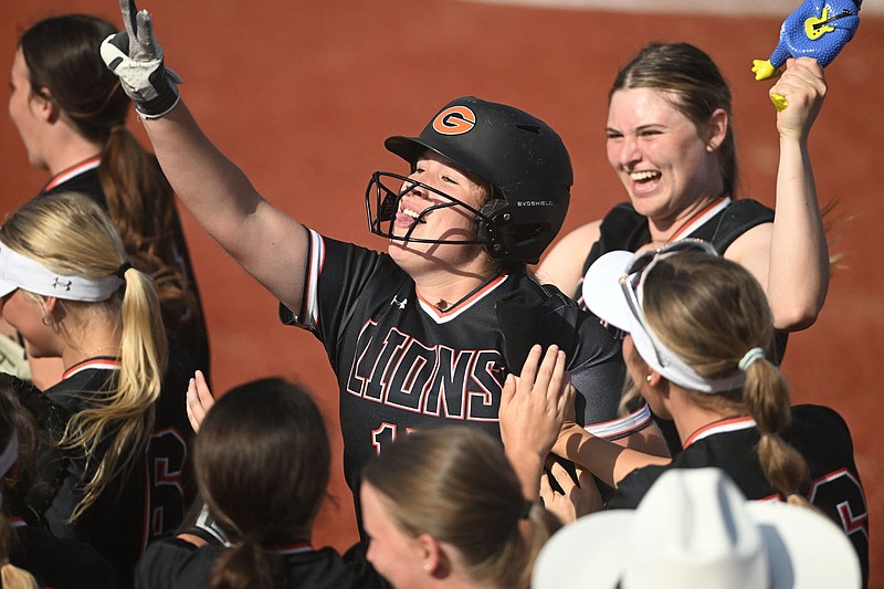 Gravette's Bentley Lowden celebrates her home run with her team during the Class 4A state softball championship against Pea Ridge on Friday at Farris Field in Conway. (Arkansas Democrat-Gazette/Staci Vandagriff)