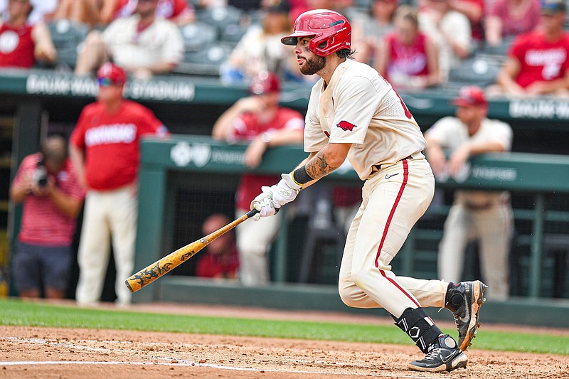 Arkansas catcher Parker Rowland hits a two-run single, Sunday, May 14, 2023, during the fifth inning of the Razorbacks 5-1 win over the South Carolina Gamecocks at Baum-Walker Stadium in Fayetteville. (NWA Democrat-Gazette/Hank Layton)