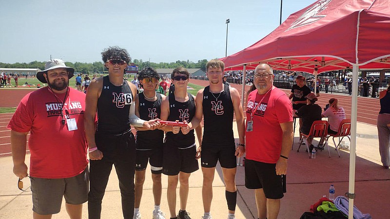 Courtesy photo Mustang coaches Chris Kane (far left) and Willie Howard (far right) stand with McDonald County's state-qualifying 4x100-meter relay squad of (from left) Josh Pacheco, Esteban Martinez, Dominic Navin and Sam Barton after the team qualified for state by finishing third after running a 43.69 at the Sectional Meet held Saturday, May 20, at West Plains.