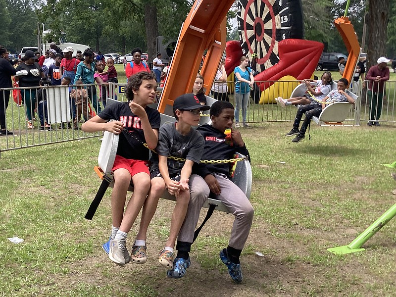 Youngsters riding the Ski Lift were among hundreds enjoying themselves at Saturday's Fun Day, held at Martin Luther King Jr. Park. (Pine Bluff Commercial/Byron Tate)