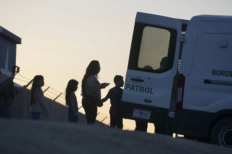 Migrants into the custody of the Border Patrol at Gate 42 in El Paso, Texas, on May 11, 2023. A policy known as Title 42 that allowed rapid expulsions of migrants was set to lift at midnight; border cities were already seeing a spike in migration.  (Todd Heisler/The New York Times)