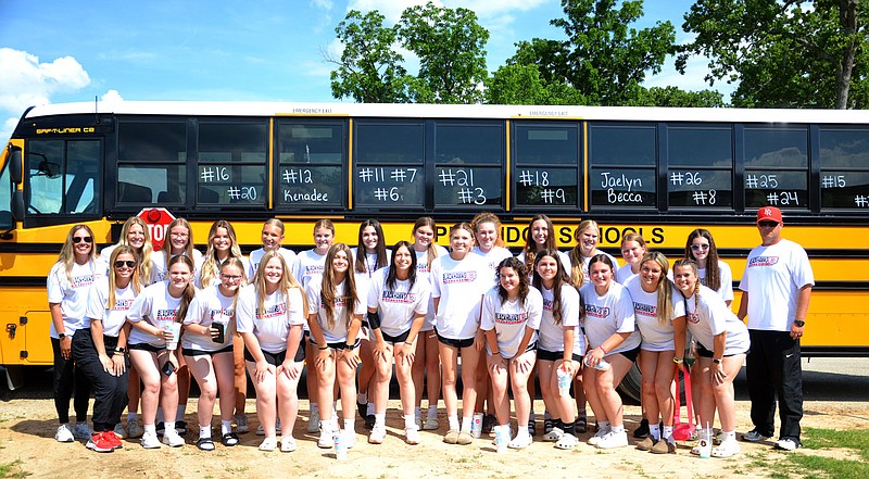 Annette Beard/Pea Ridge TIMES
The Lady Blackhawk softball team with coaches Josh Reynolds (far right), Elzie Yoder and Peyton Wright (far left) prepared to get on the bus Thursday afternoon for the trek to Conway to play in the championship game of the 4A State Tournament in Conway.