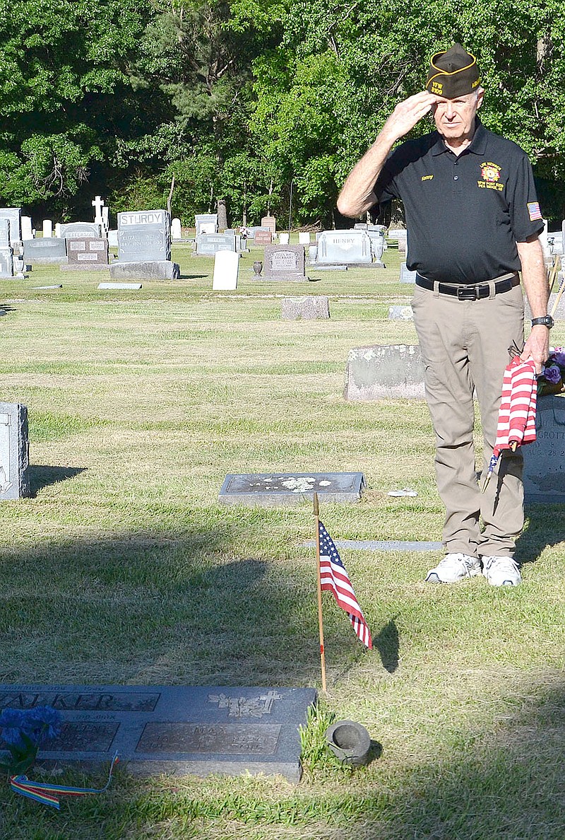 Annette Beard/Pea Ridge TIMES file photograph
Members of the Pea Ridge Veterans of Foreign Wars have placed flags on the graves of veterans for many years. They will be placing American flags at 8 a.m. Saturday, May 27, on graves of veterans at Pea Ridge Cemetery in recognition of Memorial Day. Anyone is welcome to participate.