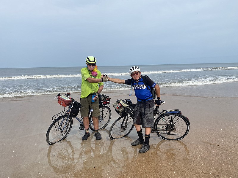 Ray Hanley (right) and Malcolm Rawlins get their wheels wet on St. Augustine Beach, Fla., 55 days and 3,000 miles from their adventure's start on Ocean Beach near San Diego. 
(Special to the Democrat-Gazette/Ray Hanley)