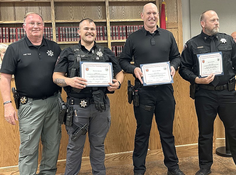 Annette Beard/Pea Ridge TIMES
Pea Ridge Police Chief Lynn Hahn, left, commended Pea Ridge Police officers, from left, Andrew Day, Jake Steele and Thomas Morris, during the May 16 City Council meeting. The men recently completed Emergency Medical Responder training.