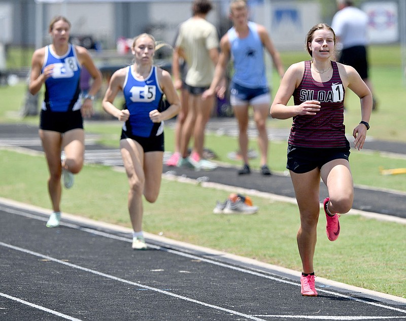 Andy Shupe/NWA Democrat-Gazette
Esther Norwood (right) of Siloam Springs leads the field Thursday, May 18, 2023, while competing in the 800-meter portion of the heptathlon on the final day of the Arkansas High School Decathlon and Heptathlon at Ramay Junior High School in Fayetteville. Visit nwaonline.com/photo for Thursday's photo gallery.