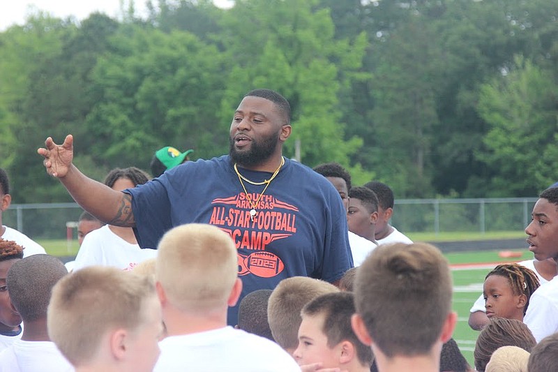Photo By: Patric Flannigan 
Vincent Thrower talks to the campers in the South Arkansas All-Star Football Camp.