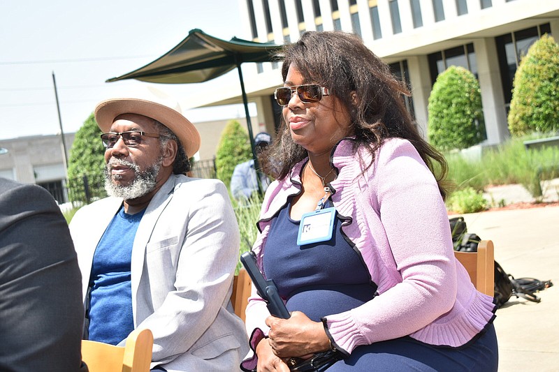 From left, Charley Williams, a watershed consultant, and Kelley Eubanks of Kee Concrete & Construction listen to a news conference by the Arkansas Black Mayors Association on the selection of watershed engineers at the federal courtyard in Little Rock on Monday. (Pine Bluff Commercial/I.C. Murrell)