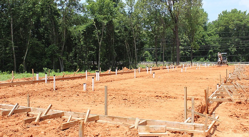 Site preparations continue on 2B Builders' 12-unit townhouse project Monday, May 22, 2023, on U.S. Highway 67 near the intersection with Farm to Market Road 991 in western Texarkana, Texas. Work on the multistory units is expected to be complete in about six months, weather permitting, said Brandon Taylor, who co-owns 2B with Brad Meador. (Staff photo by Stevon Gamble)