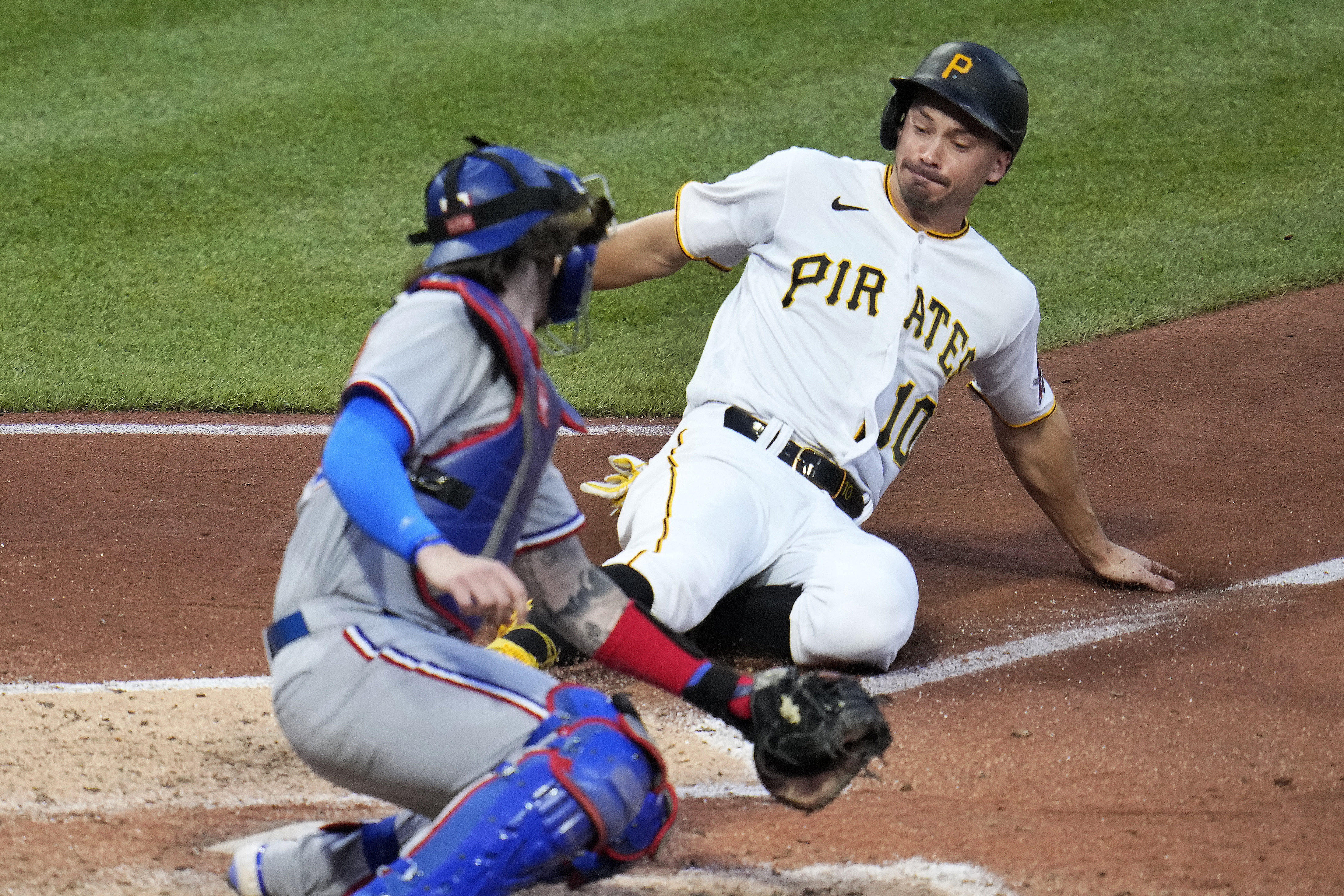 Pittsburgh Pirates' Ke'Bryan Hayes celebrates as he crosses home