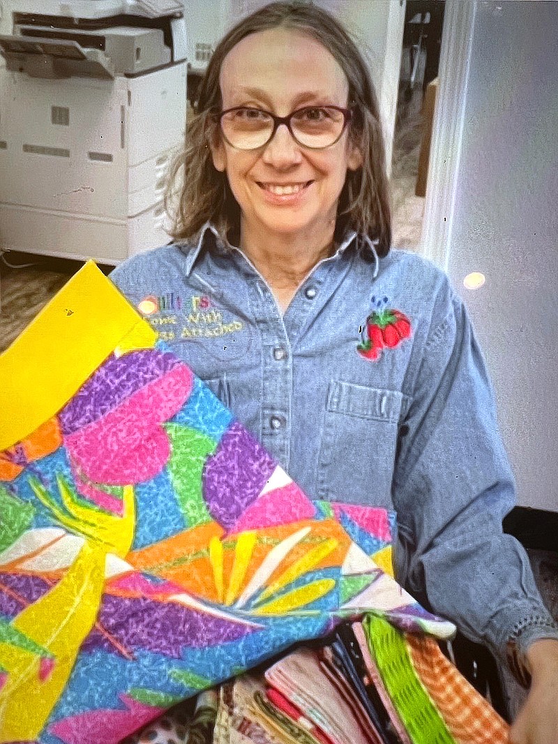 Sharon Parrett of Crazy Quilters is shown with a previous craft. - Submitted photo